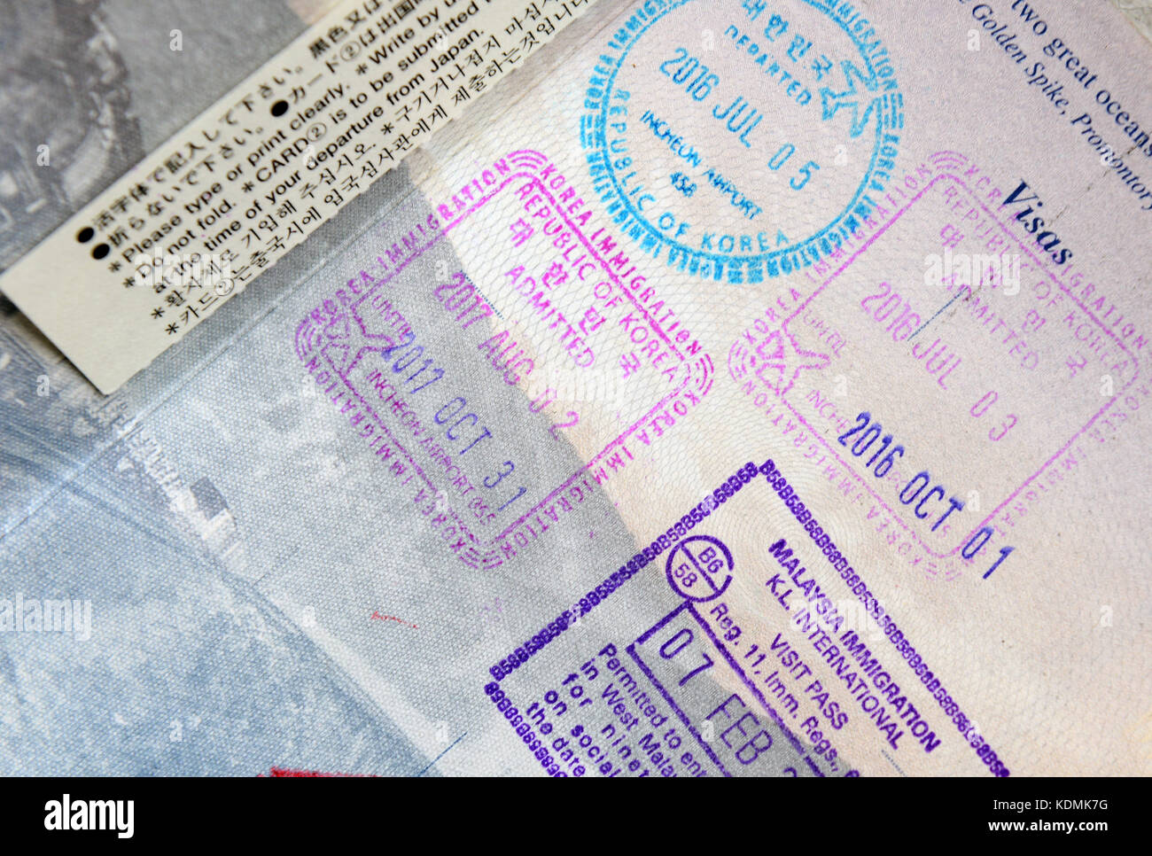 Closeup of Immigration stamps in Passport showing travel concept Stock Photo