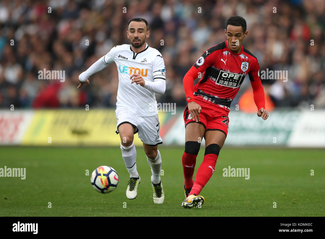 Huddersfield Town's Tom Ince (right) and Swansea City's Leon Britton ...