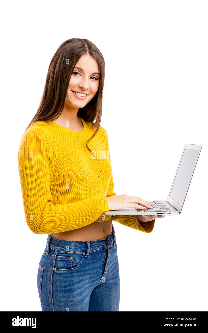 Beautiful and happy girl working with a laptop, isolated over white ...