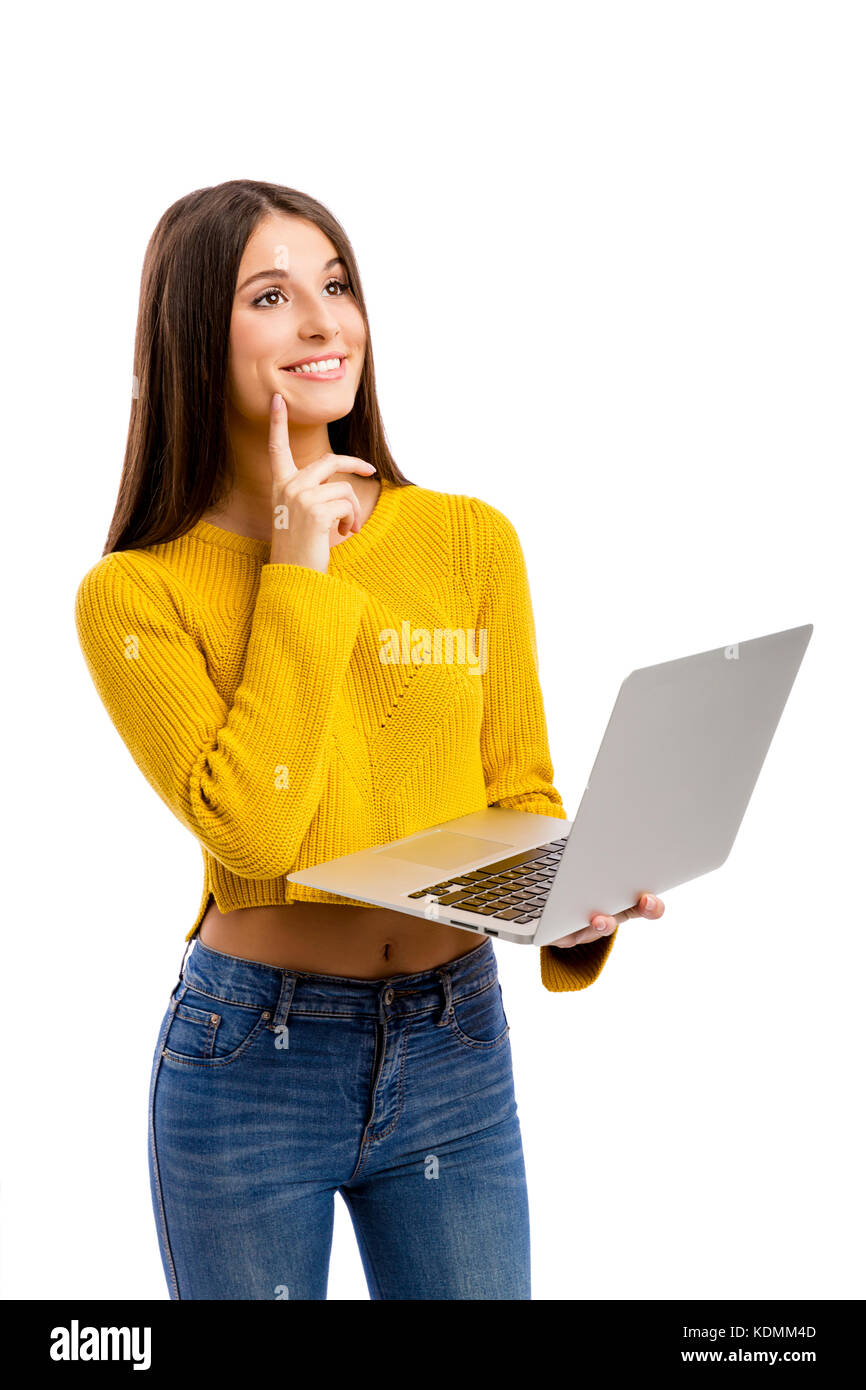 Beautiful and happy girl working with a laptop, isolated over white ...