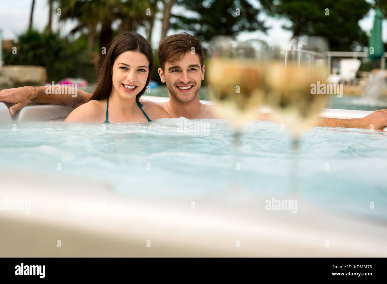Young couple inside a jacuzzi and tasting wine Stock Photo Alamy