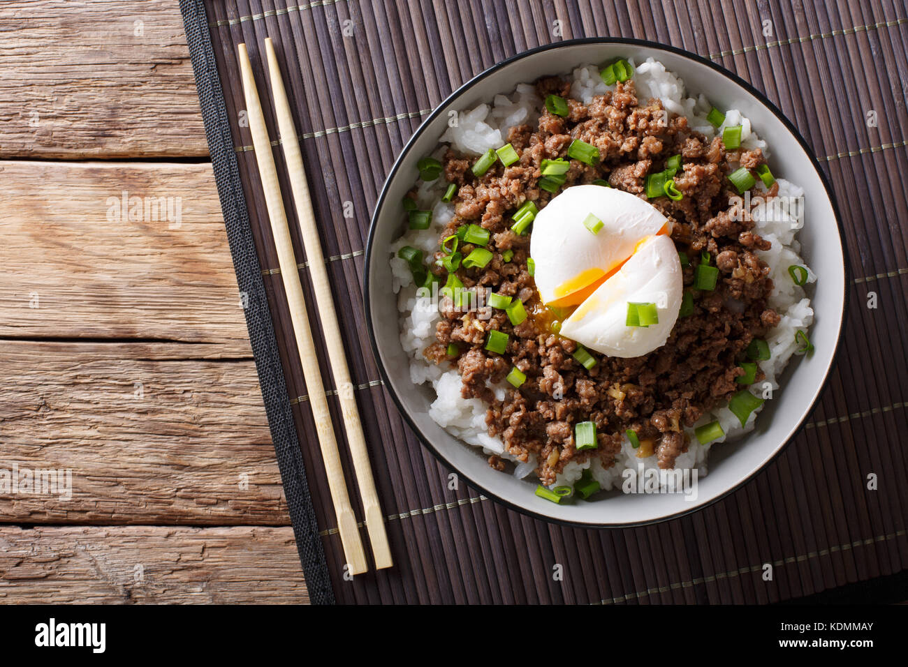 Japanese spicy beef Soboro with egg benedict, rice and green onion