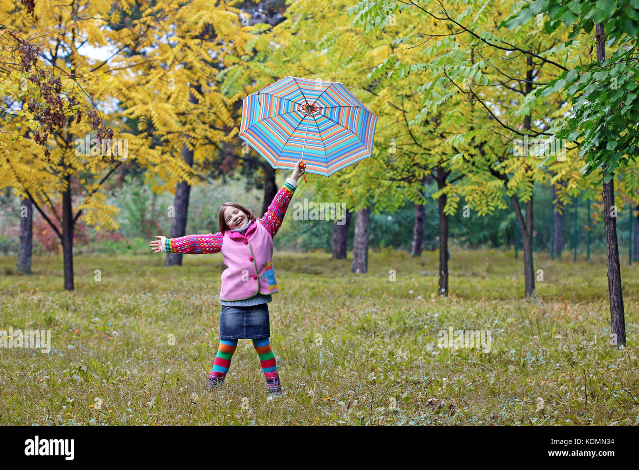 happy little girl in park autumn season Stock Photo - Alamy
