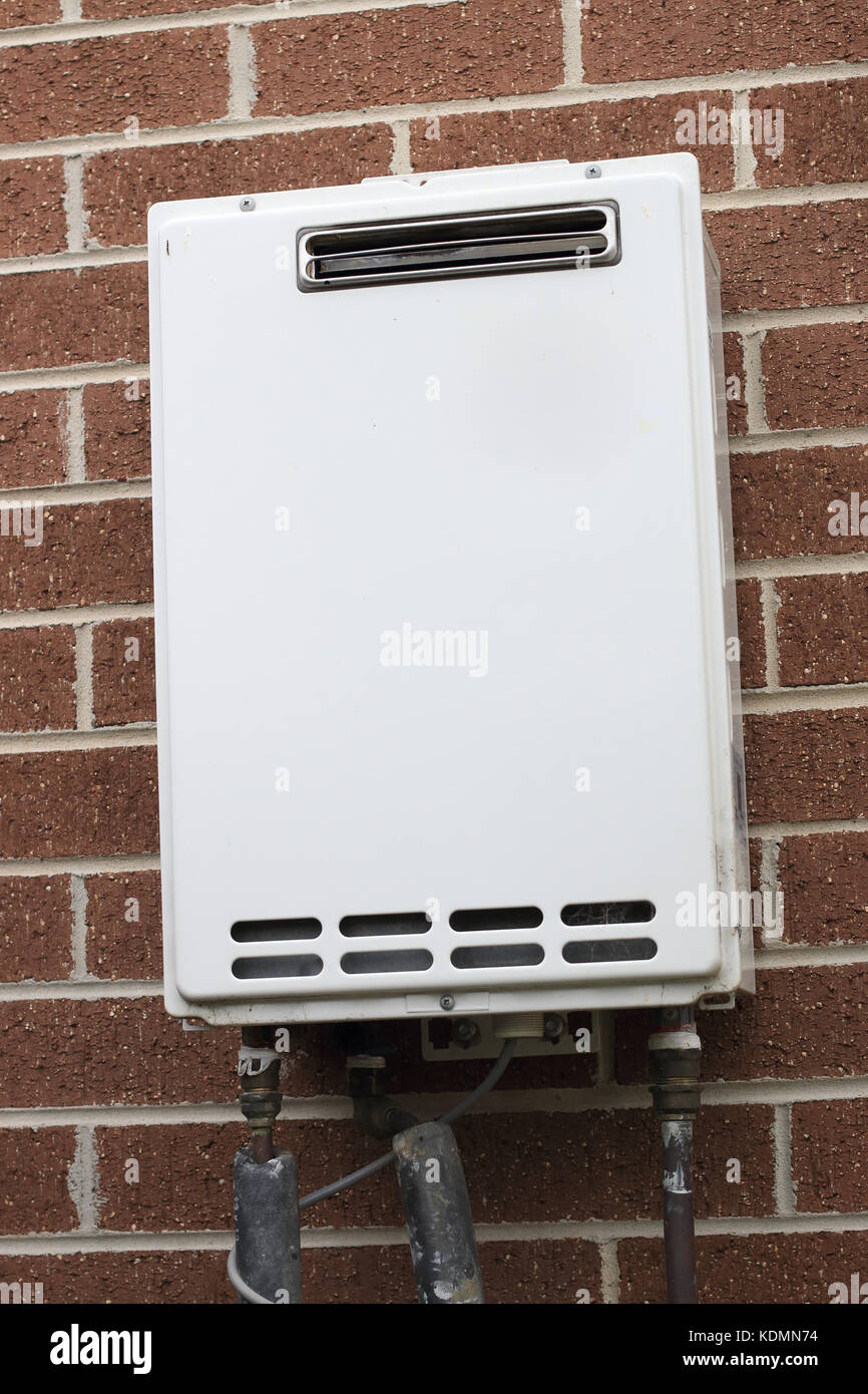 Gas Water Heater on brick wall Stock Photo