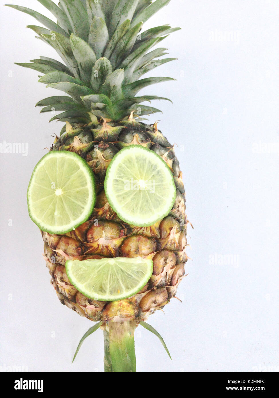 pineapple with mouth and eye made from lime Stock Photo Alamy