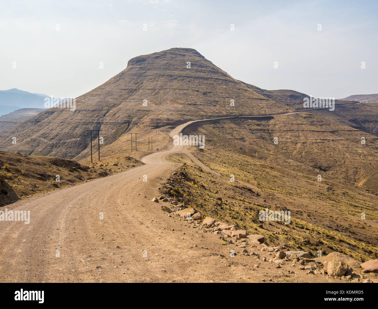 Dangerous and curvy mountain dirt road with steep drop to the valley, Lesotho, Southern Africa Stock Photo