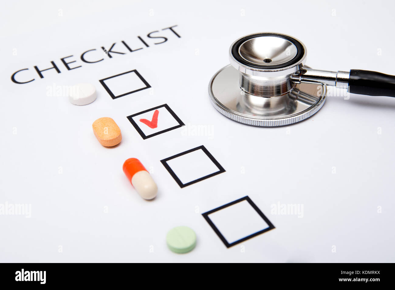 Checklist on white paper with stethoscope Stock Photo