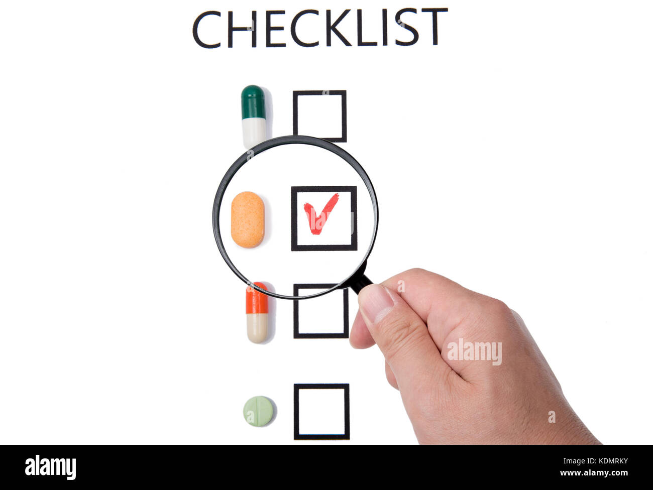 Checklist on white paper with Magnifier Stock Photo