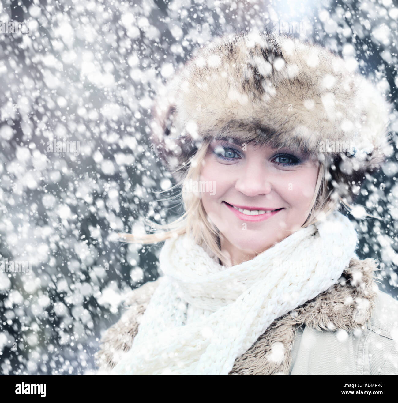 Winter Woman Outdoors. Fashion Portrait of Pretty Girl Wearing Winter Hat Stock Photo