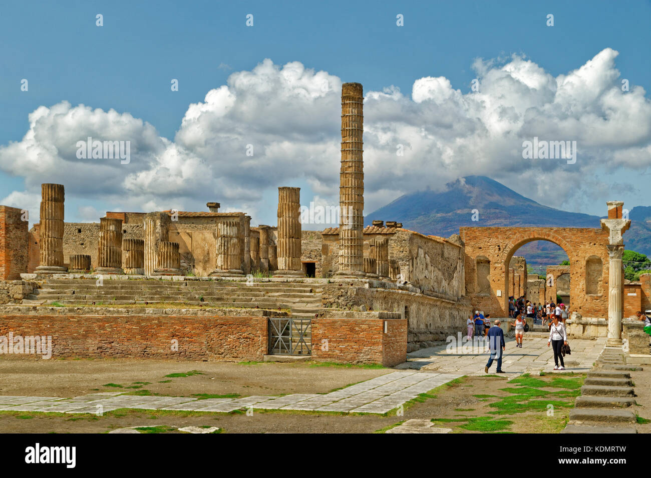 Temple of Giove & Trajan Arch at the Forum in the ruined Roman city of Pompeii at Pompei Scavi near Naples, Italy. Mount Vesuvius in the distance. Stock Photo