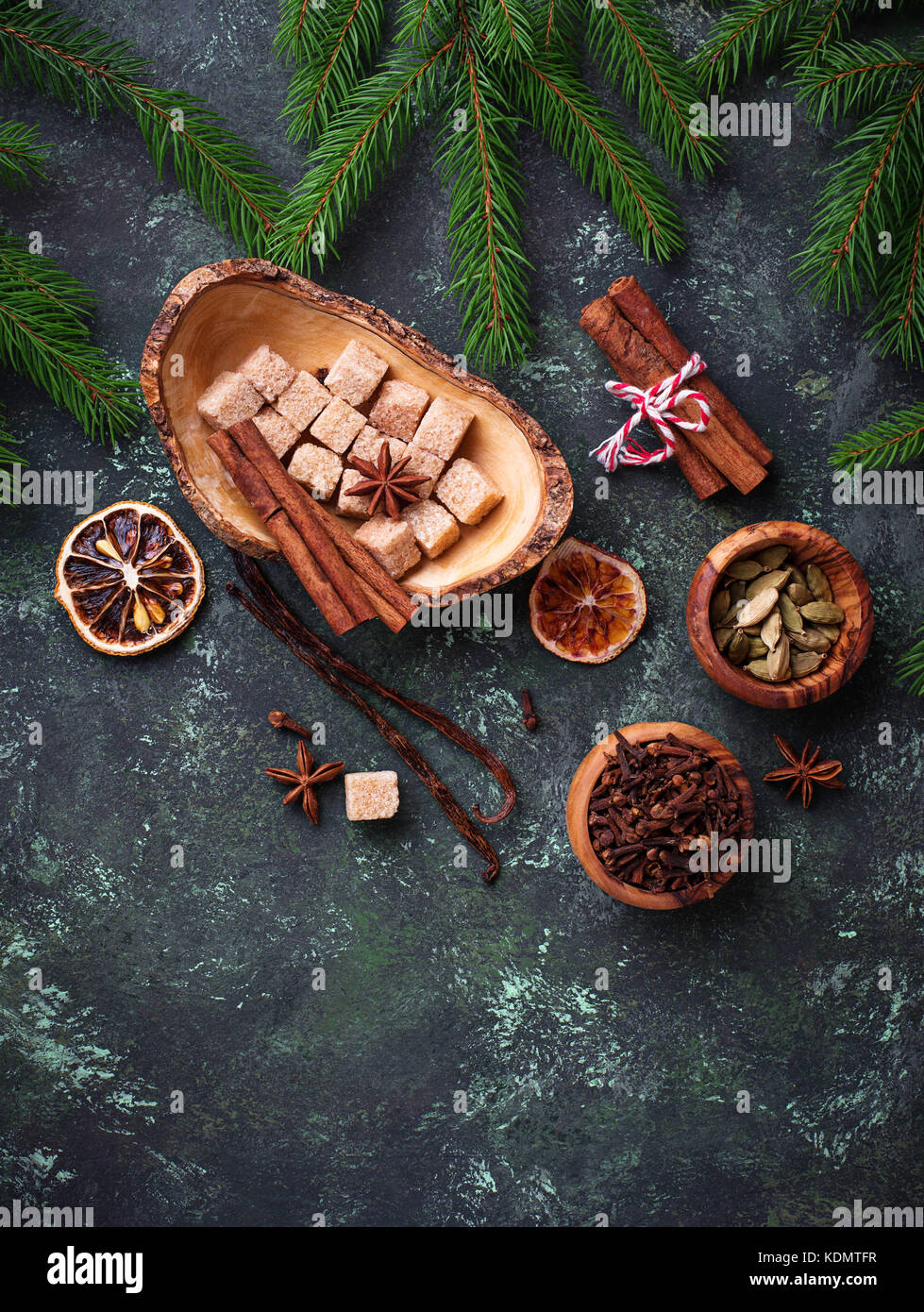 Traditional Christmas spices on green background. Stock Photo