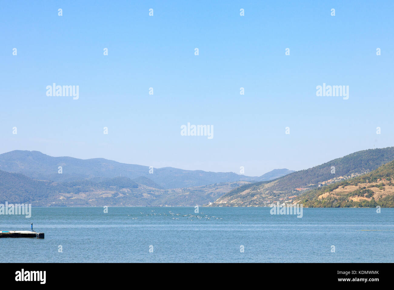 Birds flying over Danube river in the Iron Gates, also known as Djerdap, which are the Danube gorges, a natural symbol of the border between Serbia an Stock Photo