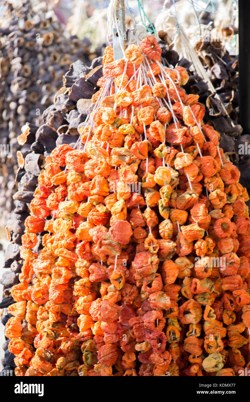 Bundles of red peppers dry in the sun Stock Photo - Alamy