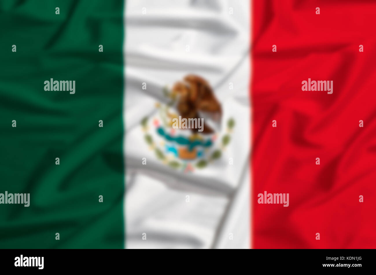 intentionally blurred Mexico flag on a silk drape waving Stock Photo