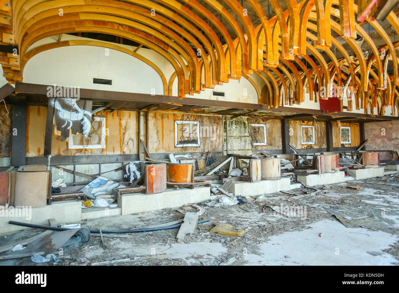 KUPARI, CROATIA - JULY 19, 2017 : Devastated coffee shop of an old ruined hotel Goricina in abandoned Yugoslavian military resort in Kupari, Croatia. Stock Photo