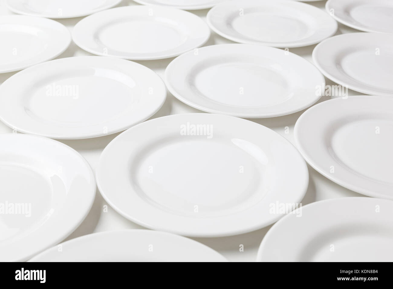 White round plates isolated on white background Stock Photo