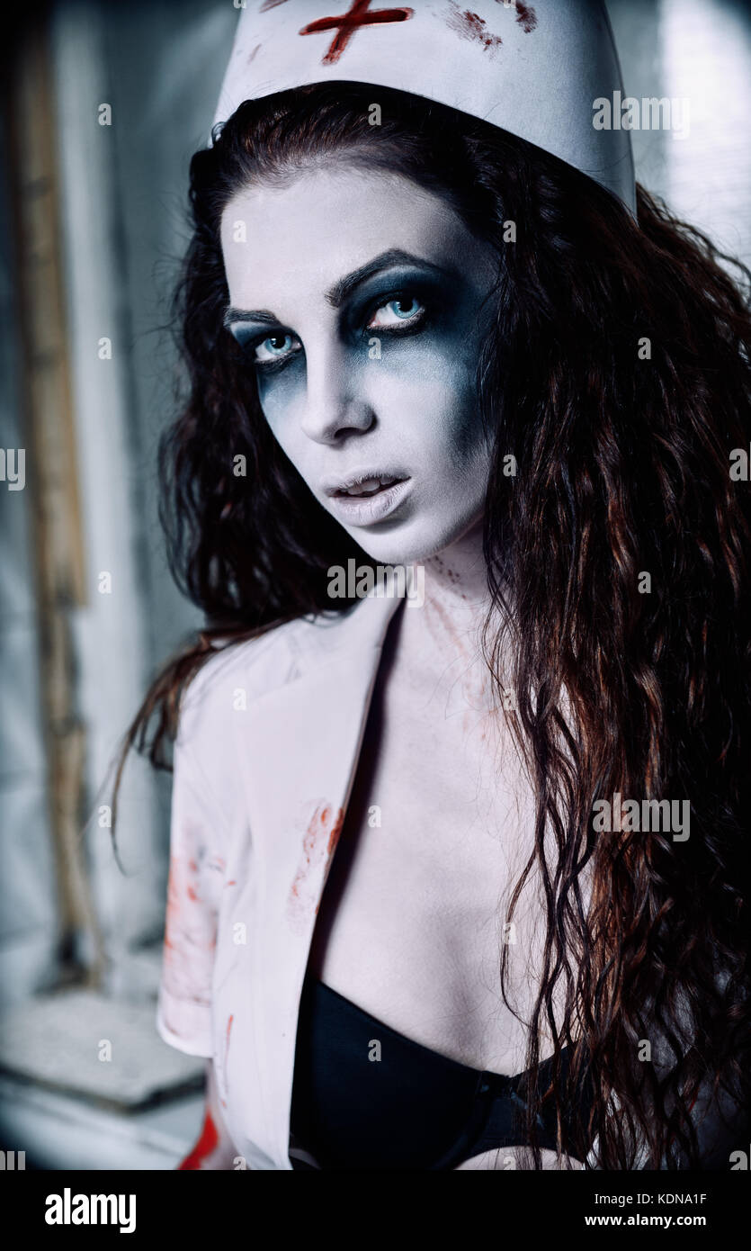 Horror shot: portrait of the undead nurse (doctor). Zombie woman (living dead) Stock Photo