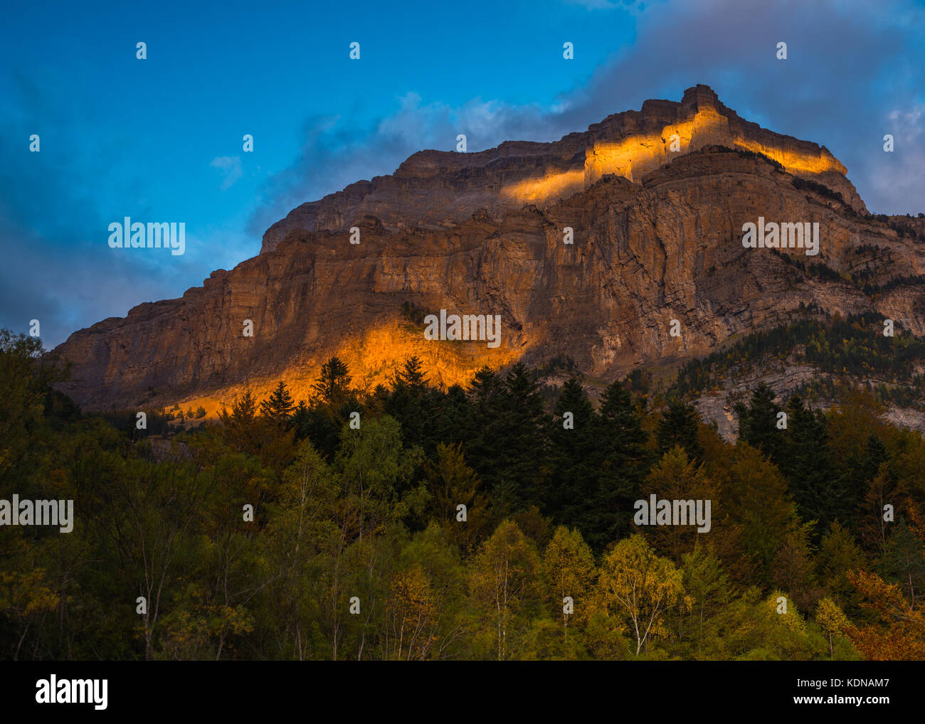 The last sunshine rays illuminating the Tozal de Mallo mountain in Ordesa National Park Stock Photo