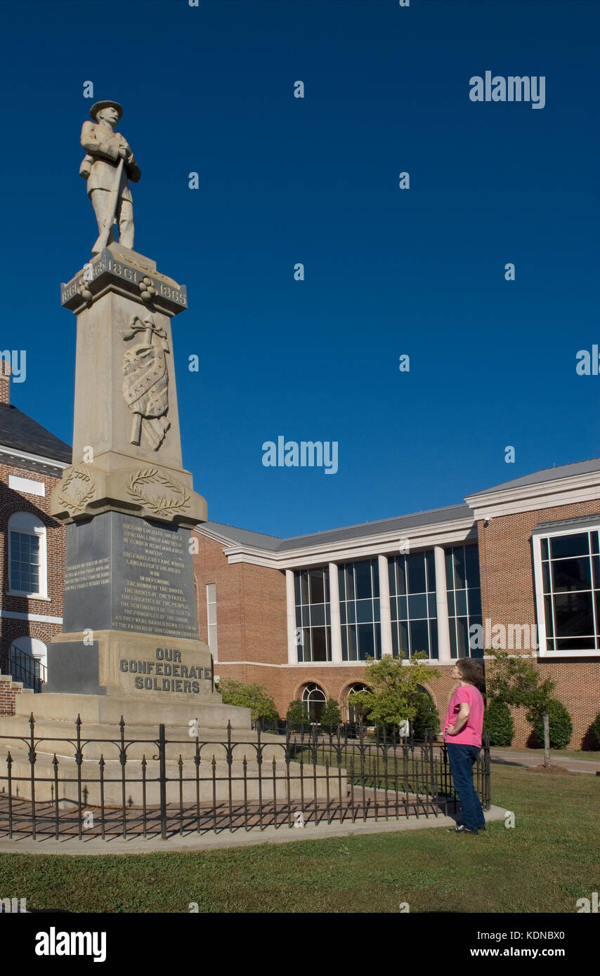 Senior Woman views Confederate memorial statue at Lancaster, South Carolina, USA. Stock Photo