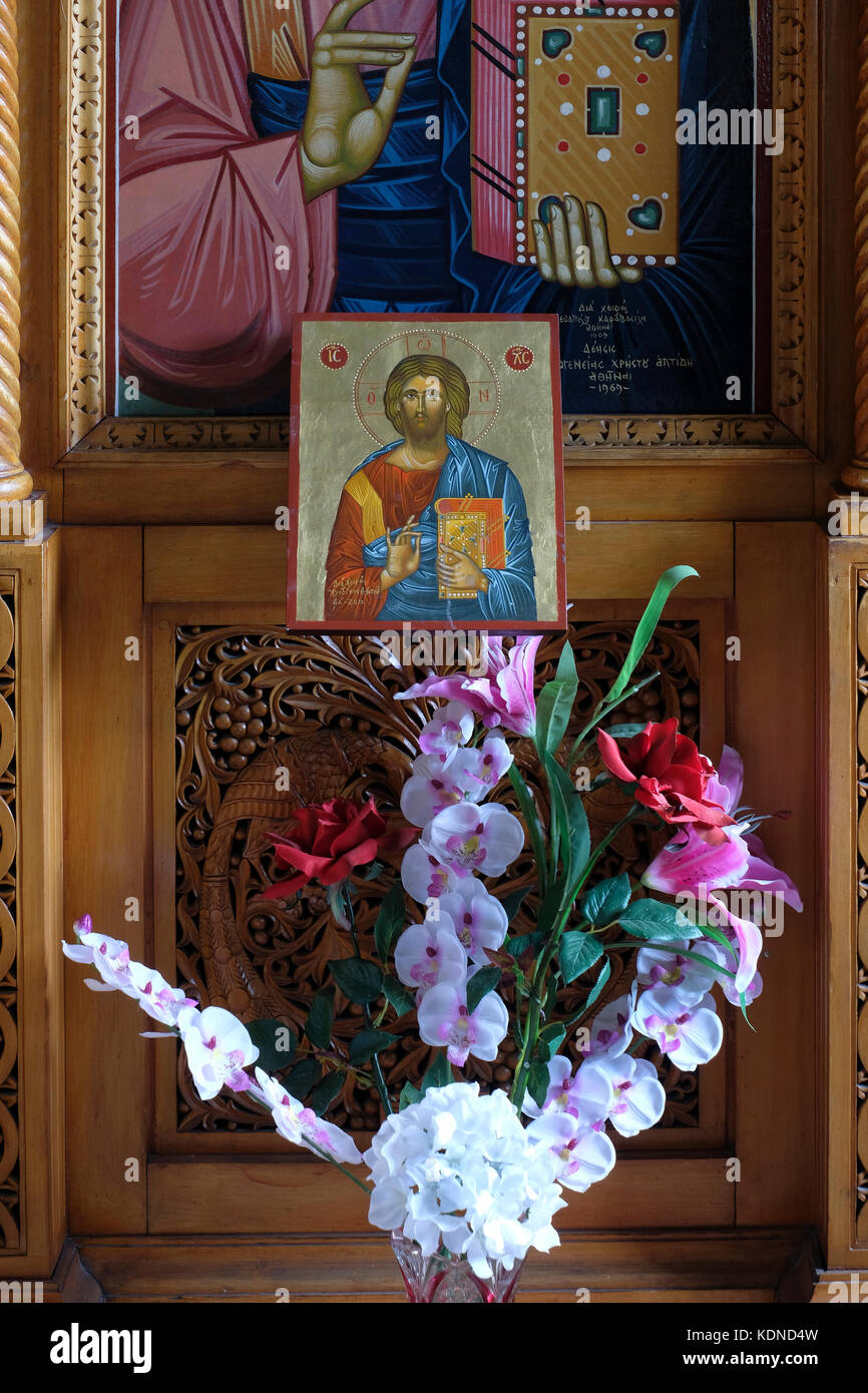 The wooden iconostasis with icons and religious paintings inside the ...