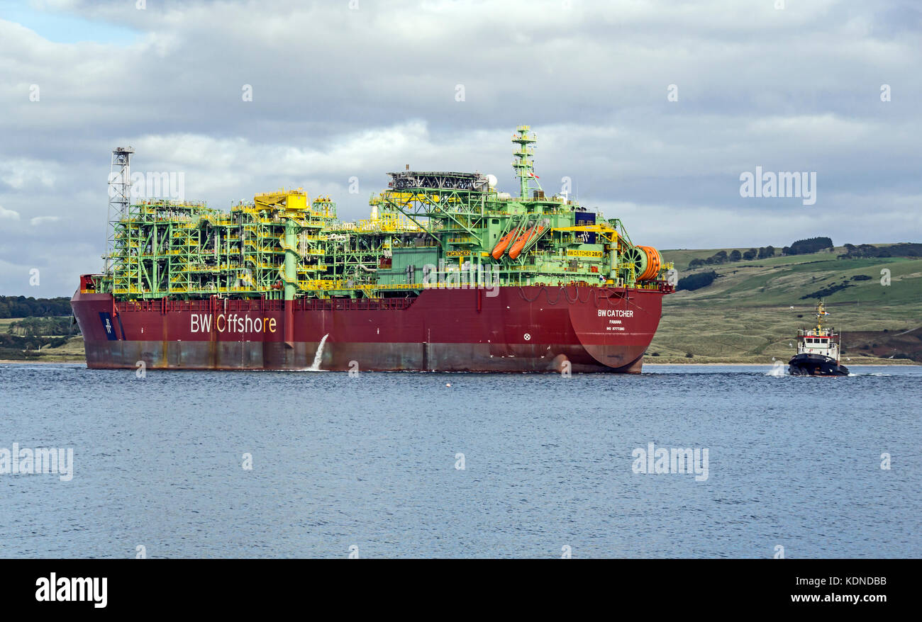 Premier Oil's floating production storage and offloading (FPSO) vessel BW Catcher preparing to berth at the Global Energy pier Nigg Highland Scotland Stock Photo