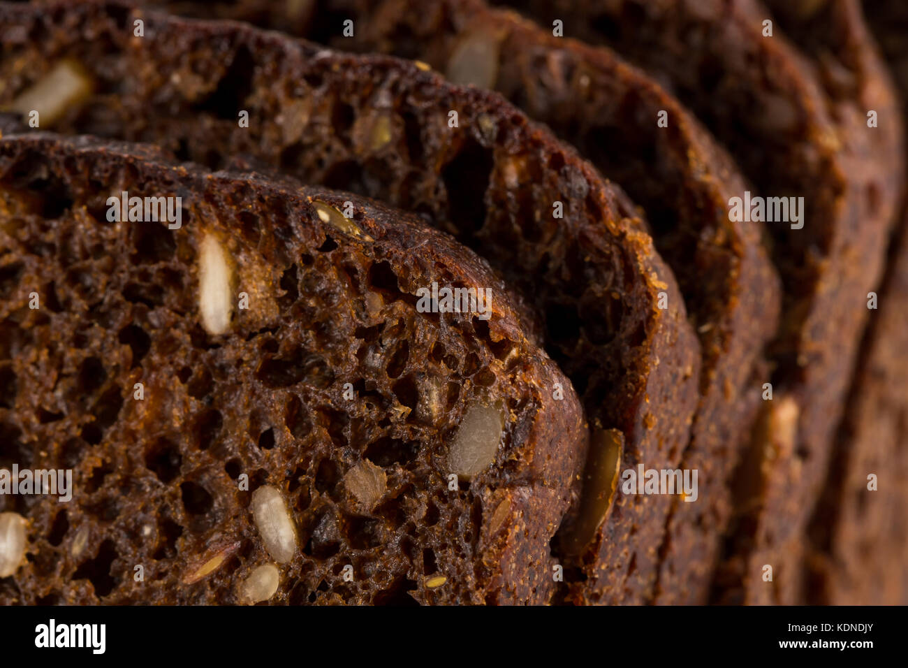 Dark rye bread with sunflower seeds background Stock Photo Alamy
