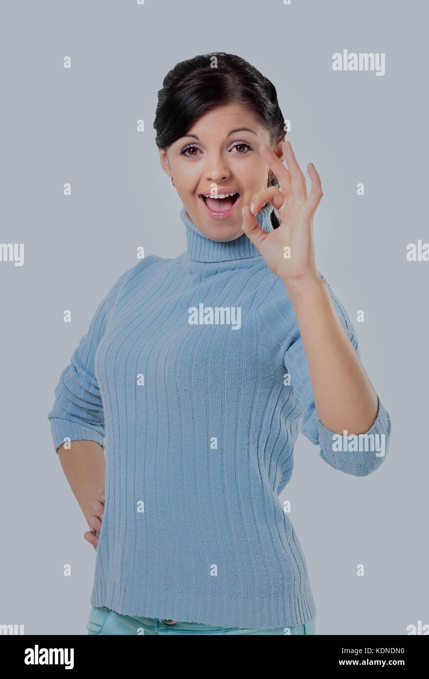 Attractive woman is showing okay sign with happiness. Stock Photo