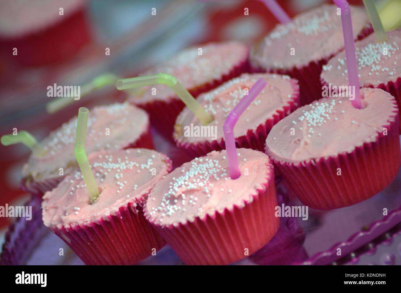 Pink cupcakes on sale at school fete Stock Photo