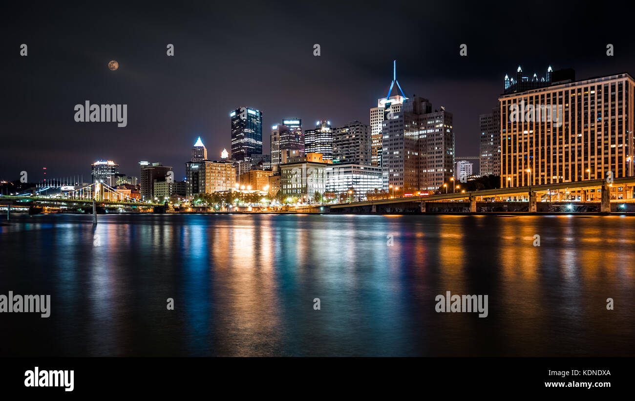 Pittsburgh downtown skyline by night viewed from North Shore Riverfront Park across Allegheny River. Stock Photo