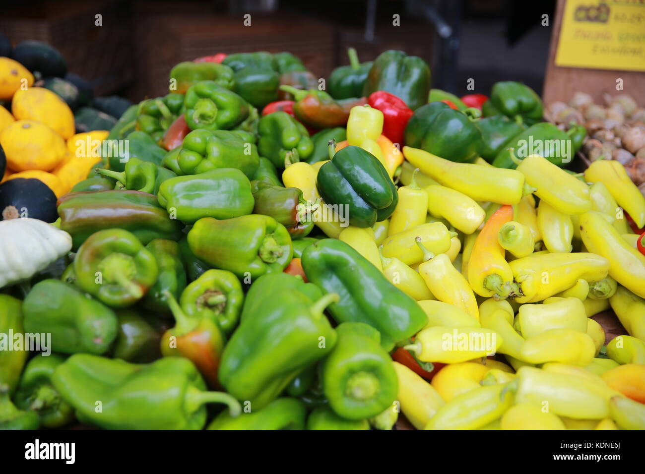 Green peppers on display at a farmers market Stock Photo - Alamy