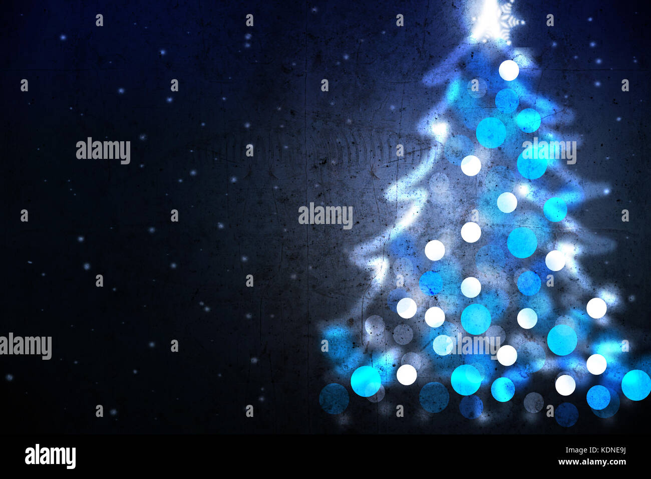 Winter holiday background with blue Christmas tree shape from lights Stock Photo