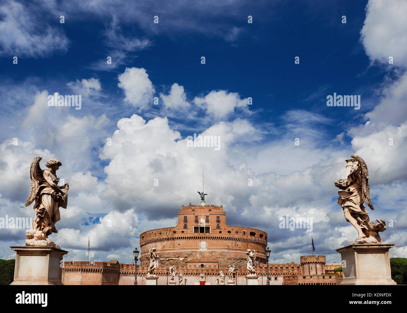 Castel Sant'Angelo (Castle of the Holy Angel) in the center of Rome with beautiful baroque angel statues and clouds Stock Photo