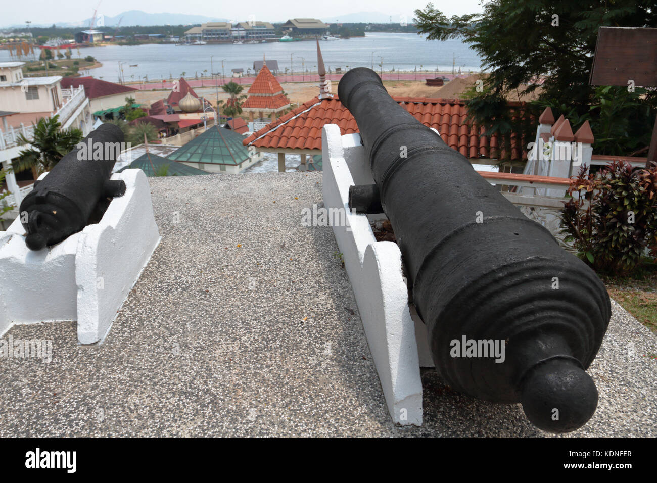 Two cannons on top of Putri Hill in Kuala Terengganu, Malaysia. The Cannons are locally known as the cannons that gave birth. Stock Photo