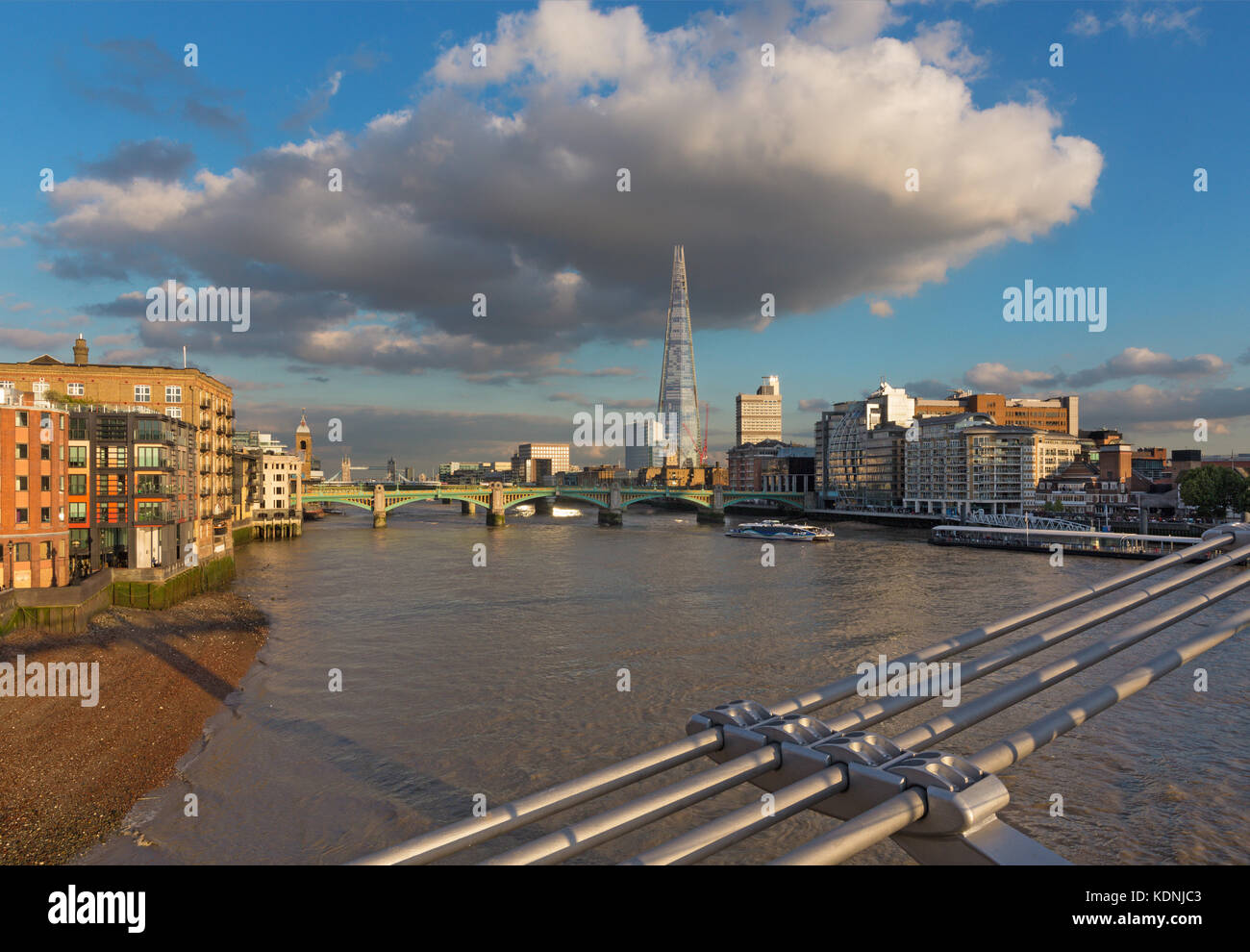 London - The Thames riverside and Shard from Millenium bridge in evening light. Stock Photo