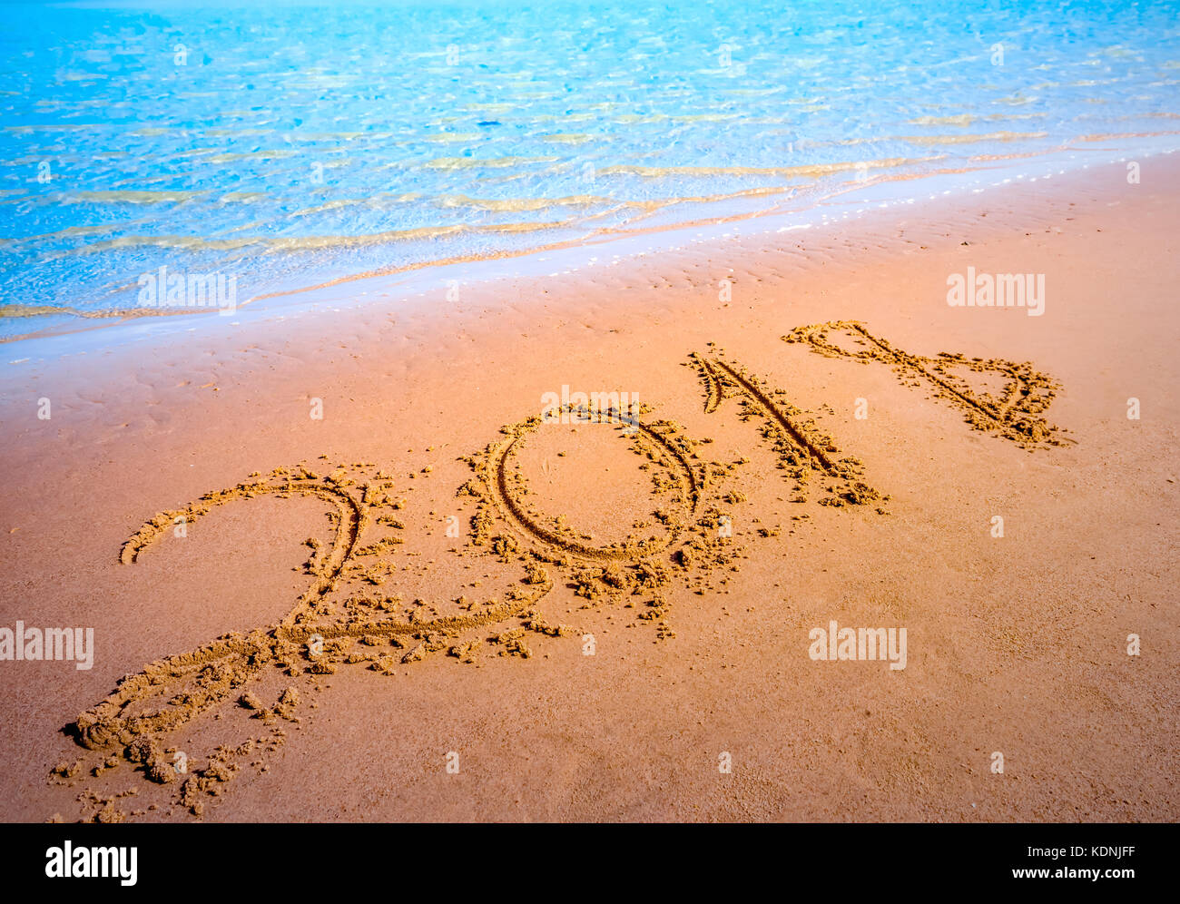 New Year 2018 coming concept. Digits on sand beach Stock Photo