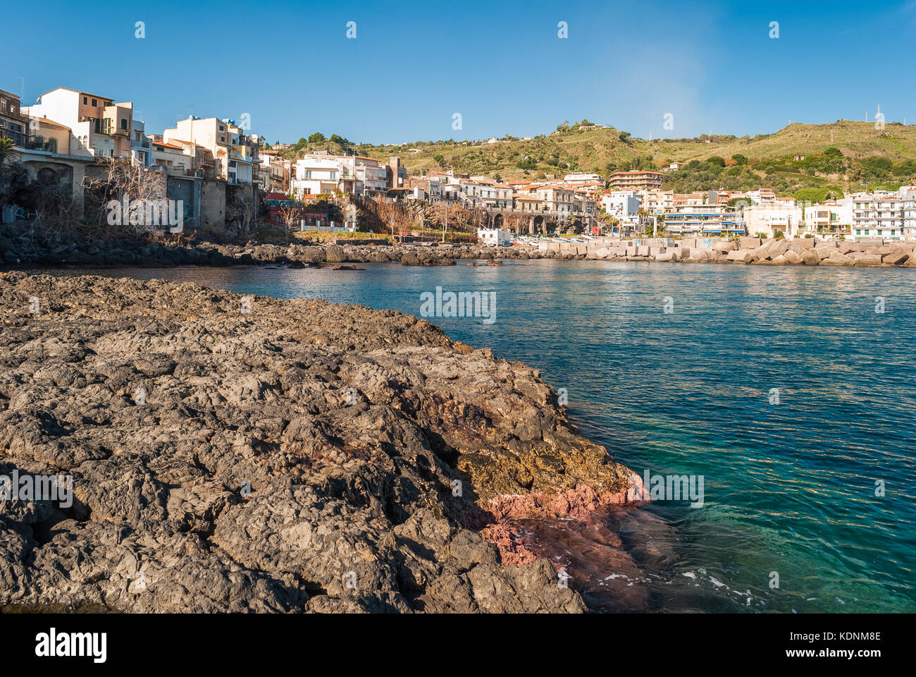 Rocky coastline with typical pillows lava in the town of Aci Castello, in Sicily Stock Photo
