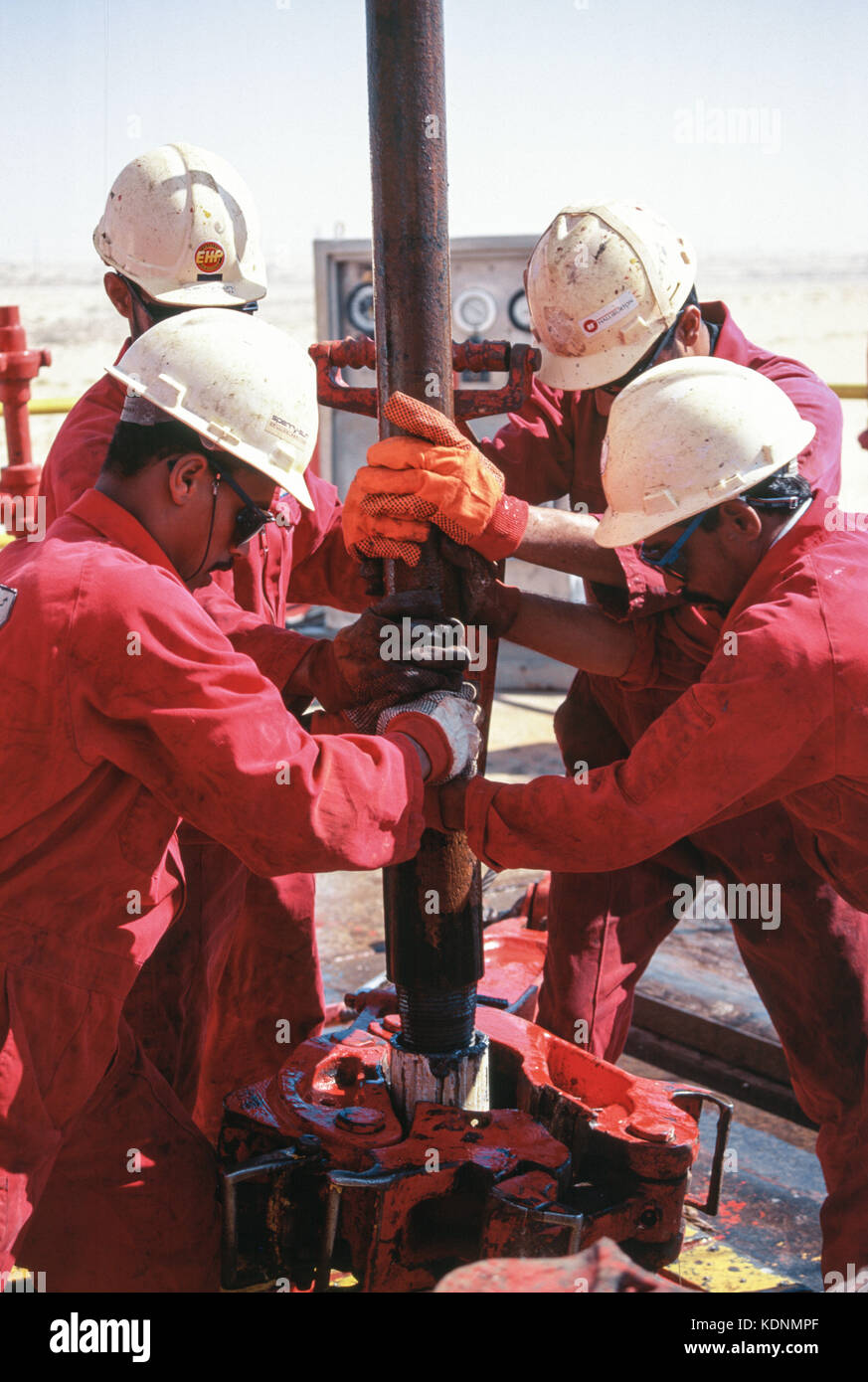 An oil rig exploring for oil and gas in the deserts of Saudi Arabia at Abqaiq Stock Photo