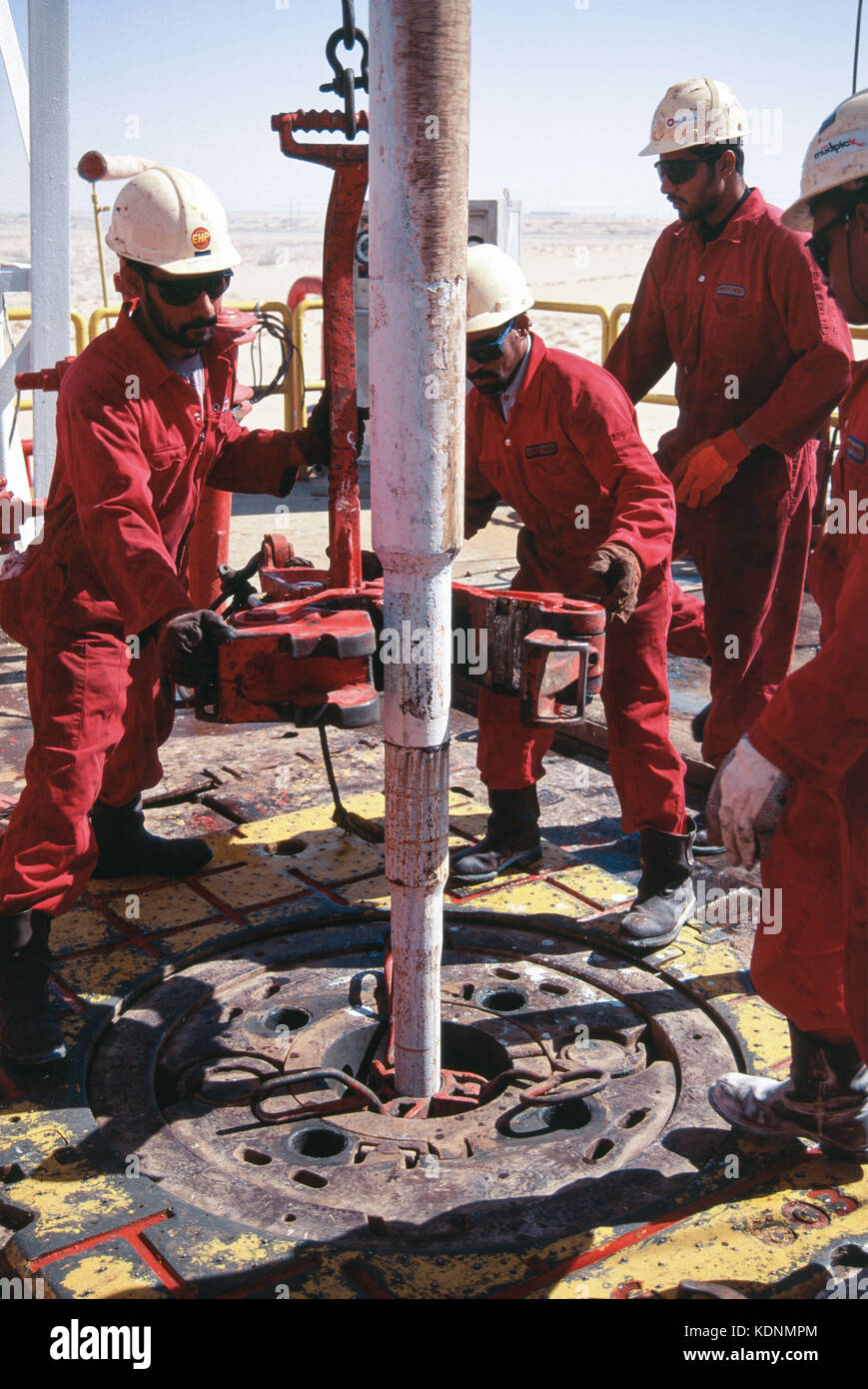 An oil rig exploring for oil and gas in the deserts of Saudi Arabia at Abqaiq Stock Photo