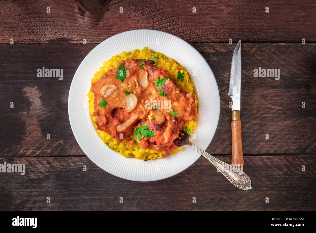 Osso buco with risotto alla milanese and gremolata Stock Photo Alamy