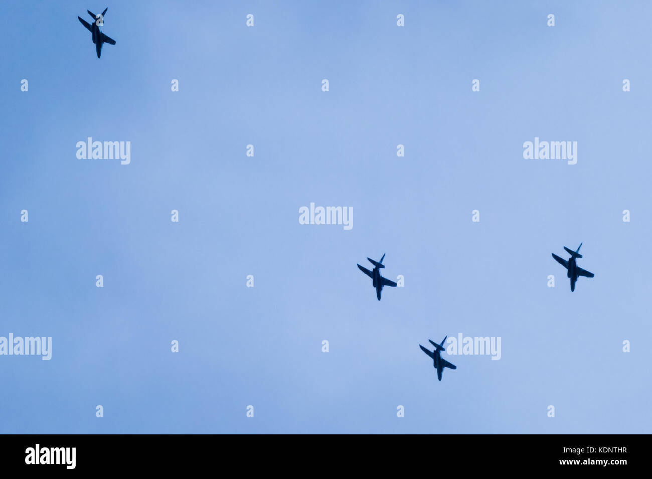 A flight pattern of a jet fighter that glides while scattering and ...