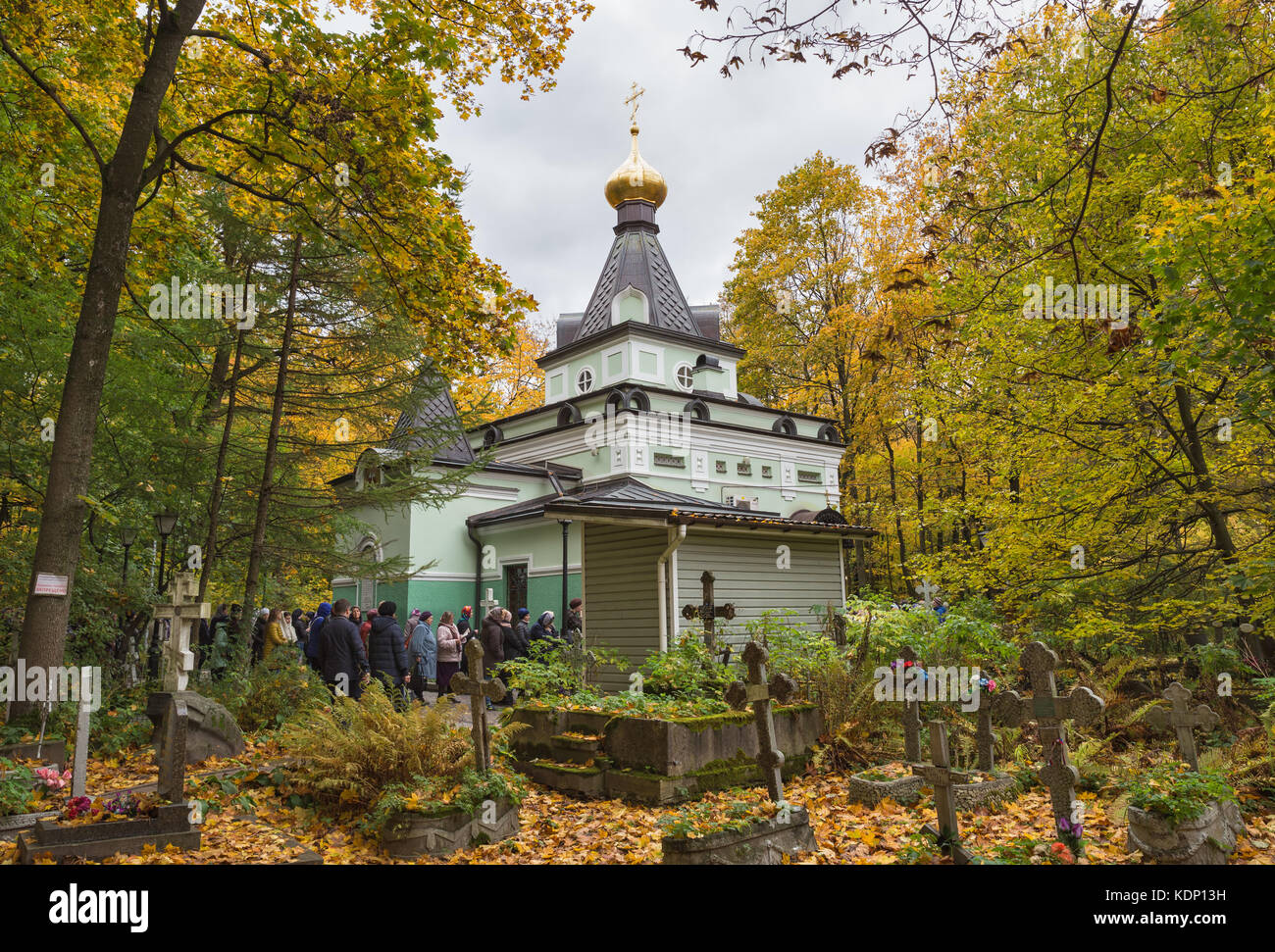 SAINT-PETERSBURG, RUSSIA - OCTOBER 14, 2017: Many people stand in line to pray and put a candle in the chapel of Saint Blessed Xenia of Petersburg Stock Photo