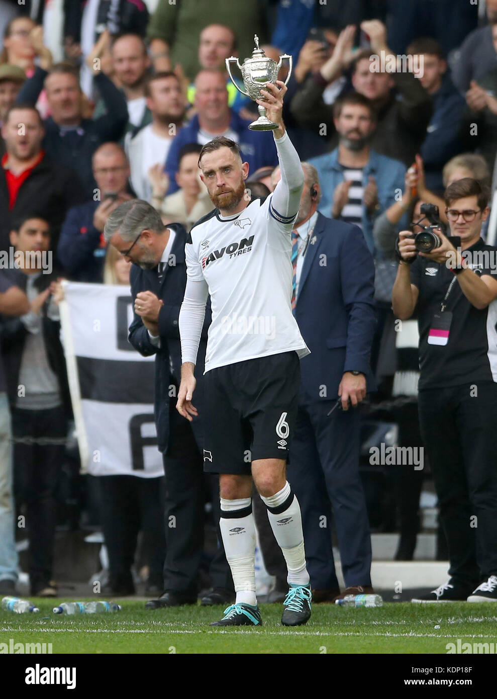 Derby County's Richard Keogh holds the Brian Clough Trophy during the