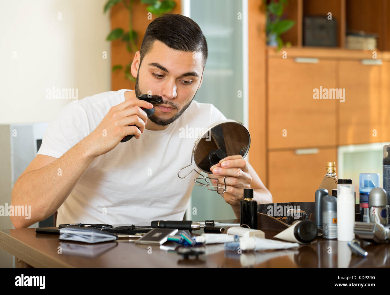 Guy shaving his mustache electric razor Stock Photo Alamy