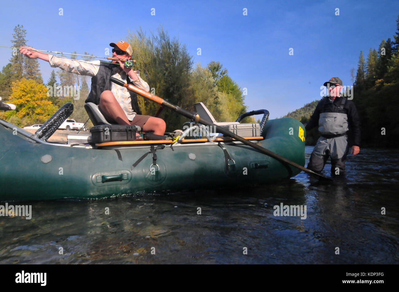 A fly fisherman and his guide readies the gear for a day of steelhead