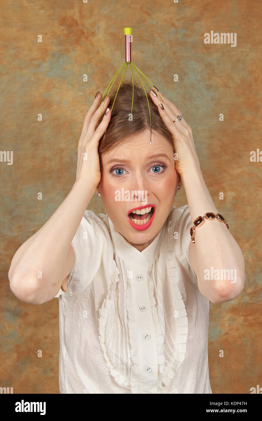 Young girl screaming with antenna on her head Stock Photo