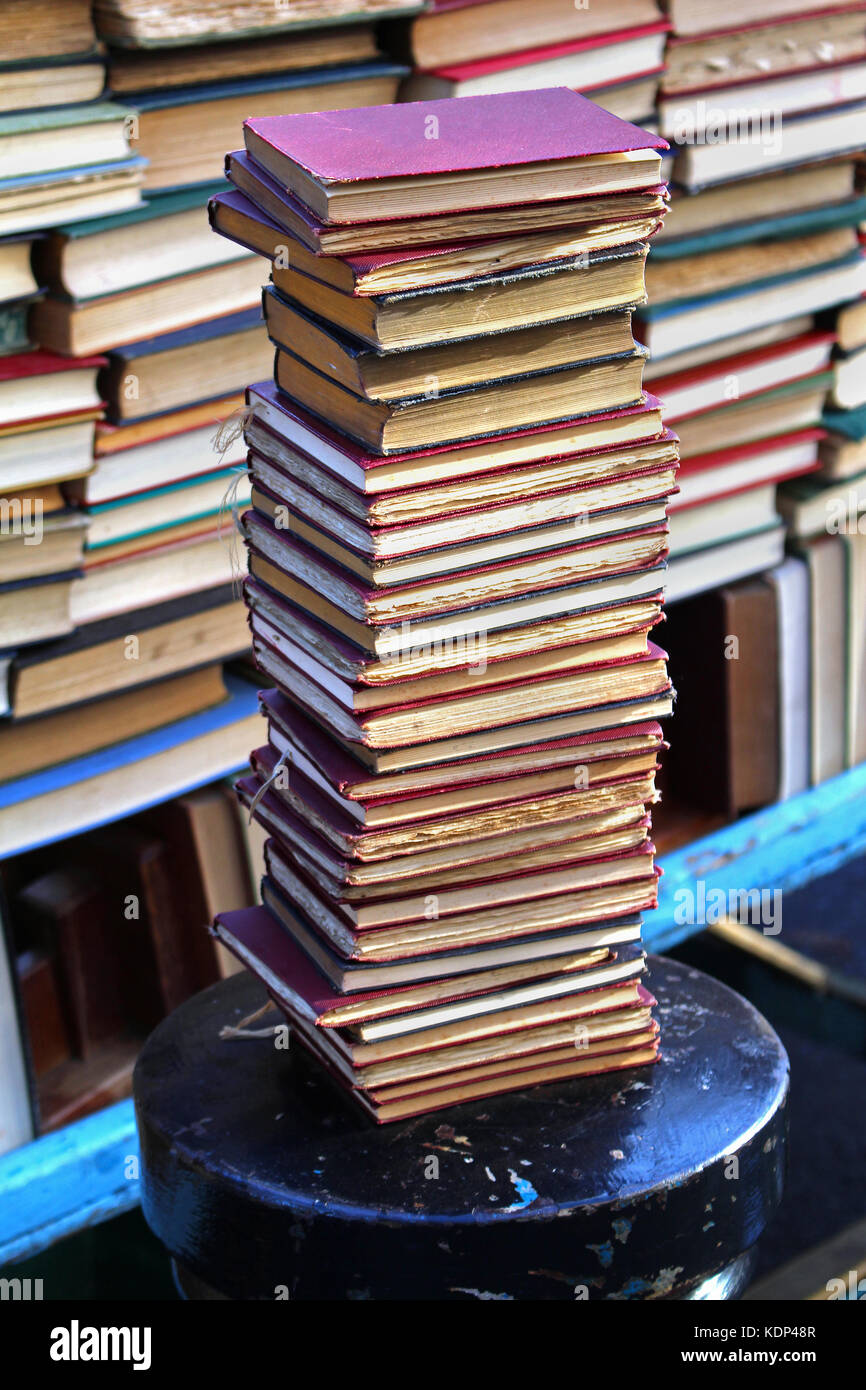 Old vintage used books stack sold on market Stock Photo Alamy