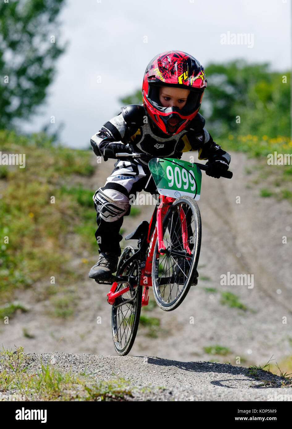 A little boy (5 yrs old) riding a BMX Stock Photo