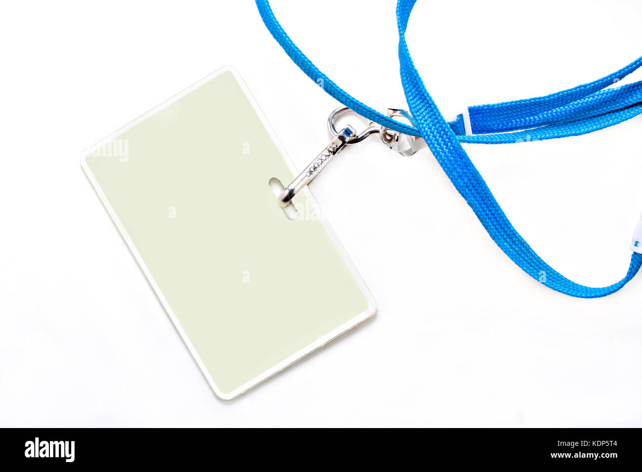 One plastic name tag on a blue lanyard.  Background is white with copy space on name tag as well as on the background. Stock Photo
