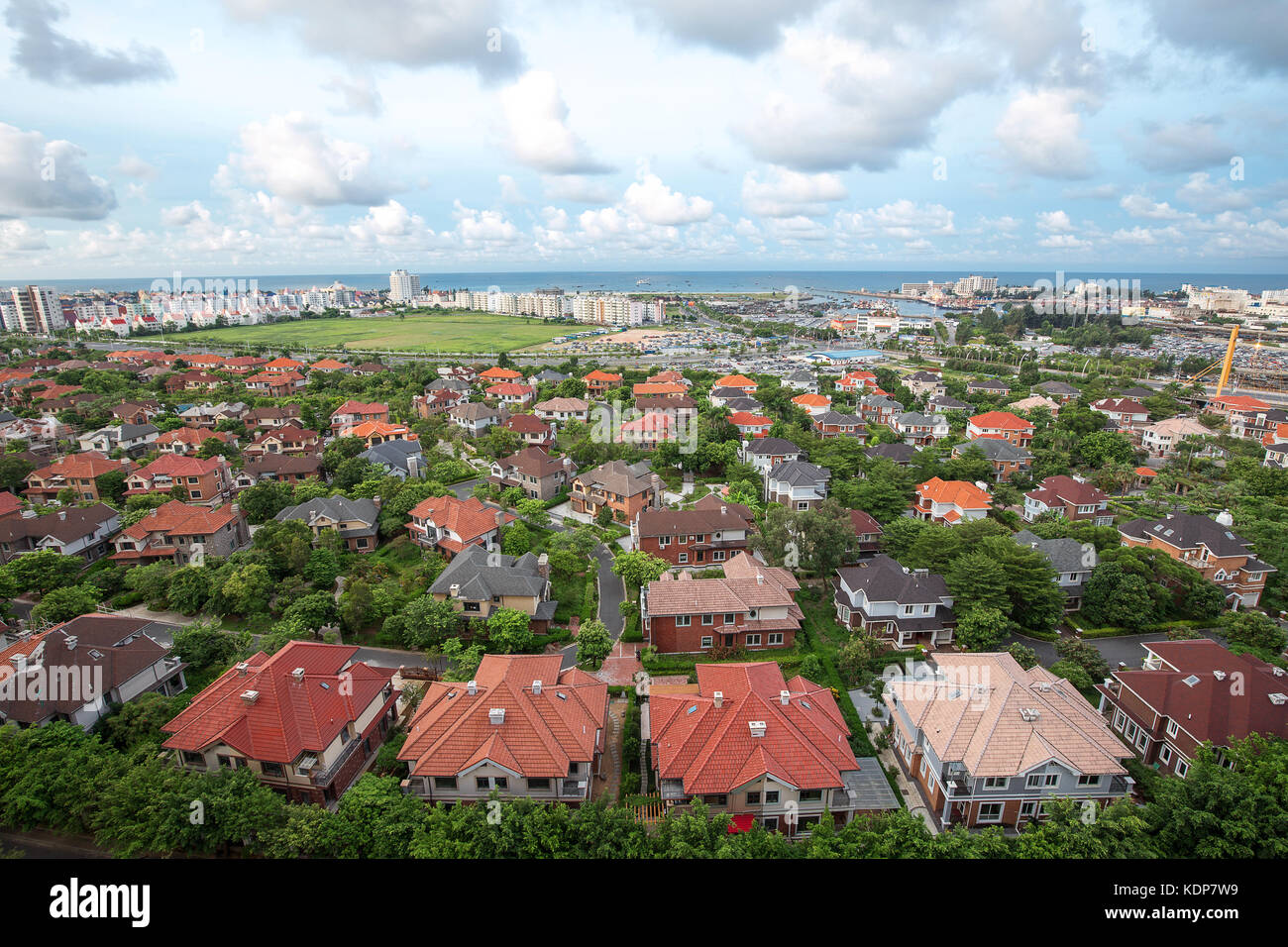 houses under the cloudy sky Stock Photo - Alamy