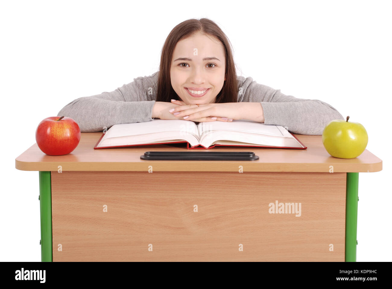 School girl sitting at a desk isolated on white Stock Photo - Alamy